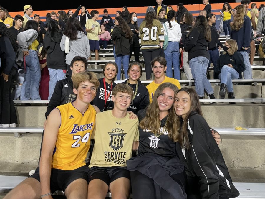 A group of Rosary and Servite students enjoying the homecoming football game. 