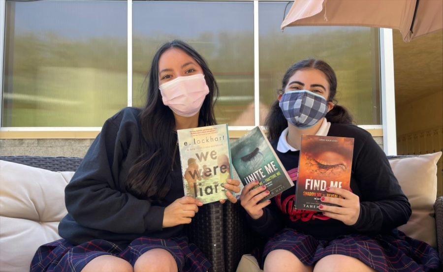 Mary and Irene hold up the books that everyone on TikTok is raving about. 