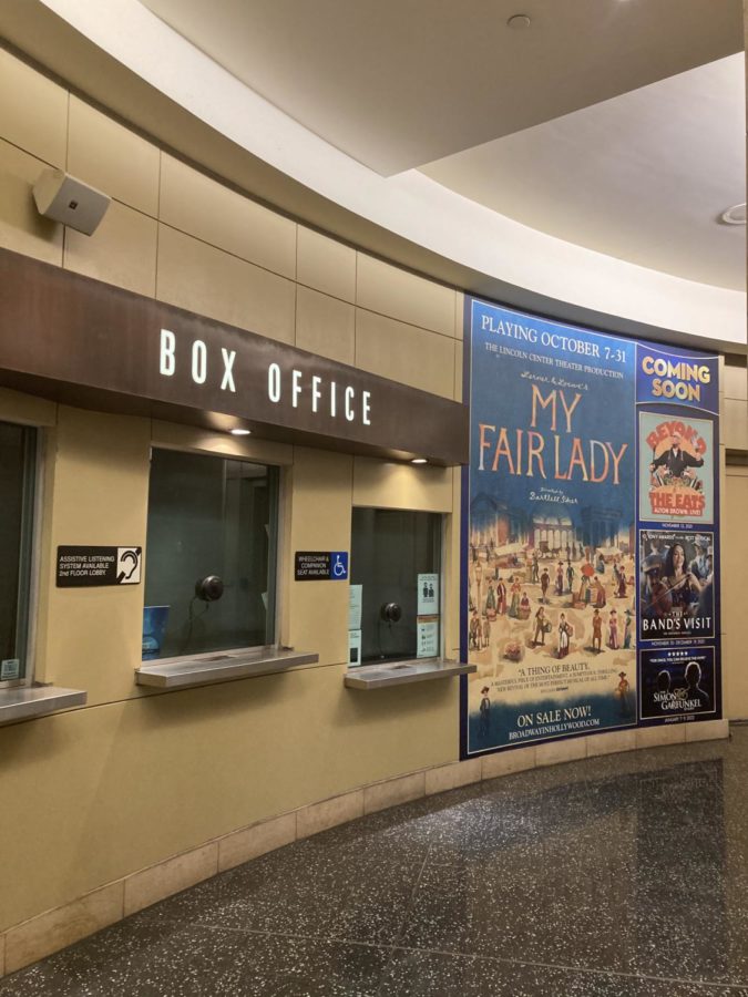 The box office outside the theatre displays a gigantic poster for the My Fair Lady national tour. Anticipation is high and the buzz of theatre-goers can be heard all around. (Photo Credit: Anna DiCrisi)