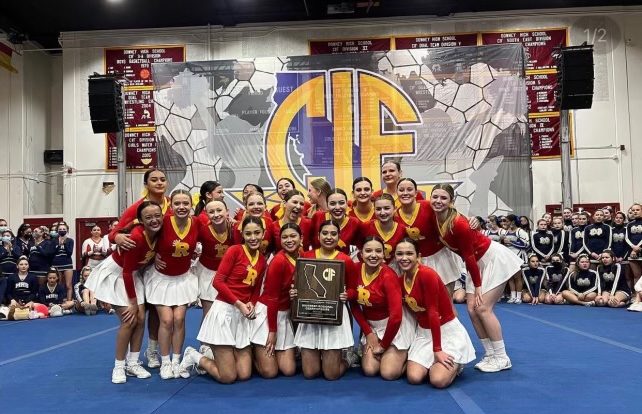 The entire cheer team was filled with smiles after being awarded CIF champs in their division. 