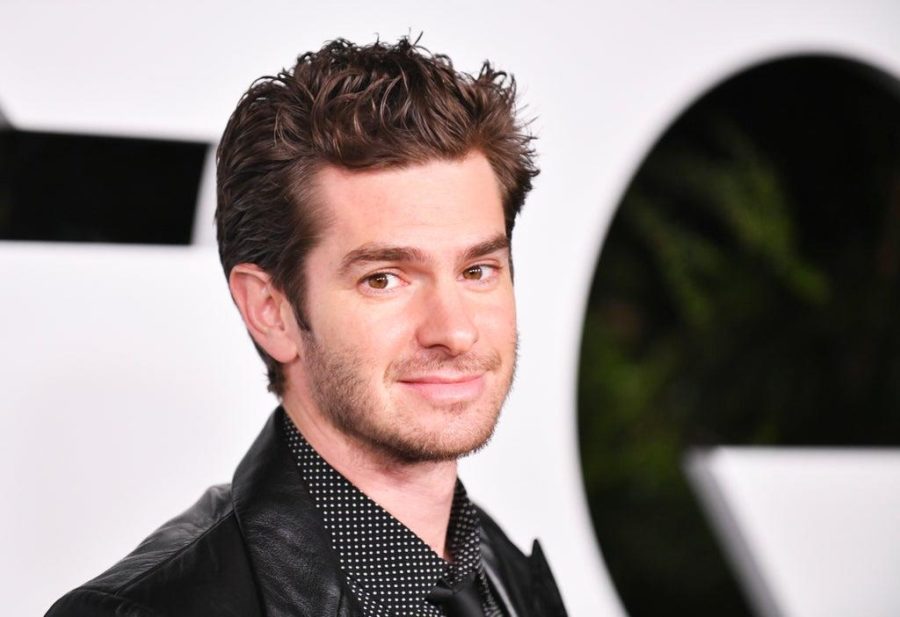 
Andrew Garfield staring into the camera during a red carpet event.