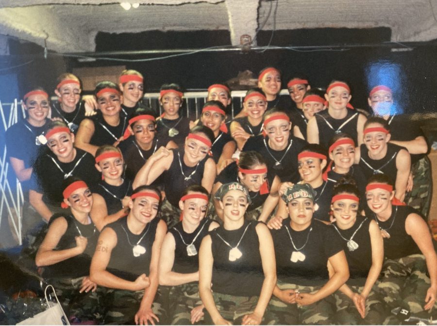 Mrs. OCampo 02 smiles with her drill before rocking the Red and Gold stage. Can you spot her? (Photo Credit: Mrs. OCampo)