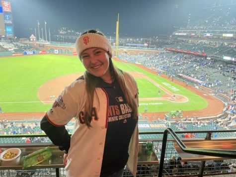 Ms. Sutcliffe loves watching baseball, and here she is cheering on the SF Giants. 
