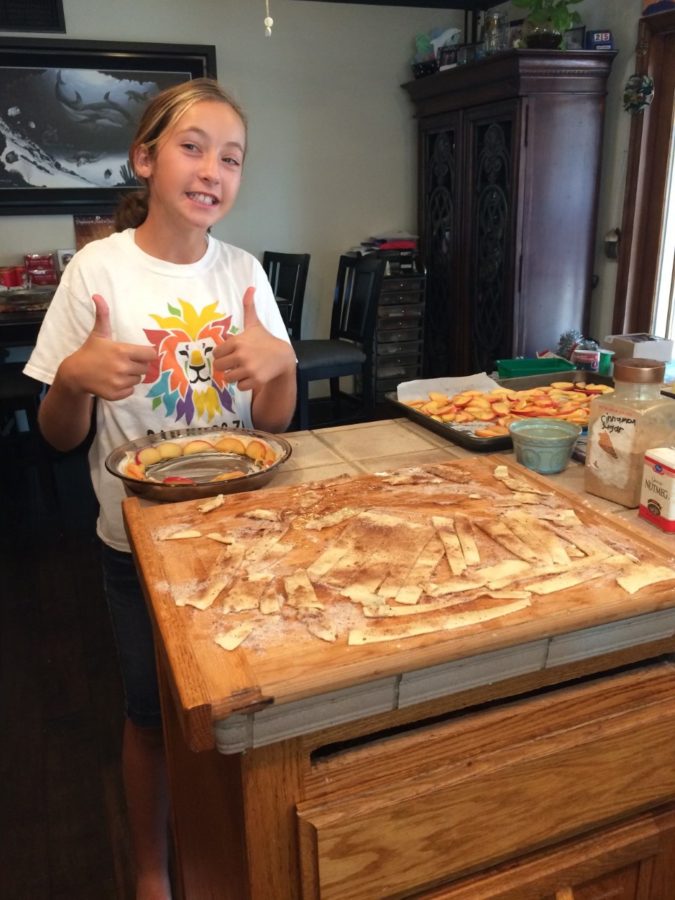10 year-old me in the process of making a pie for Thanksgiving.