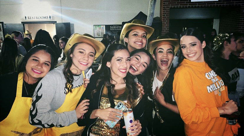 From left to right: McKinley Fregoso 24, Ava Bernard 24, Amber Lizardi 23, Samara DeLeon 23, Emma Oskorus 23, Adrianna Arroyo 23, Emma Vasquez 23. These girls were all smiles after performing their best during last years Red and Gold performance (something a Servite boy will never understand). 
