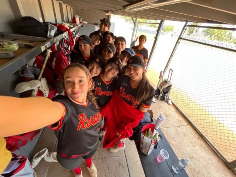 The team taking a post-game selfie in the dugout.