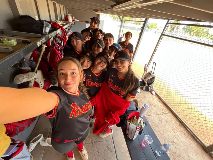 The team taking a post-game selfie in the dugout.