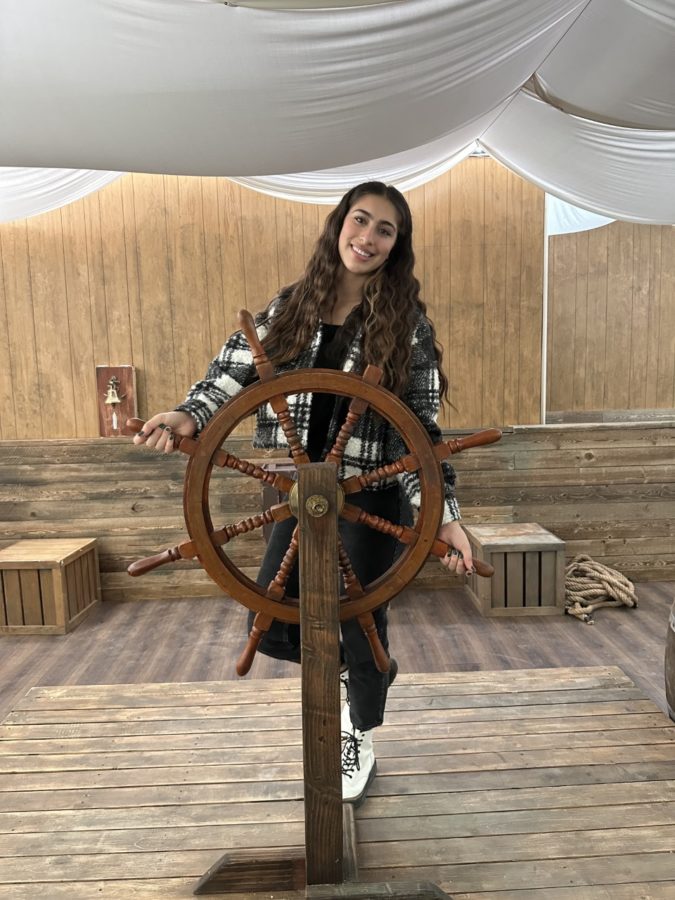 Sarah steers the ship after leaving Prosperos island.