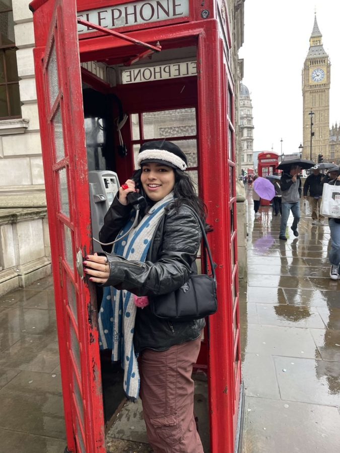 Juliet posing for a candid in the famous Red Telephone Box.