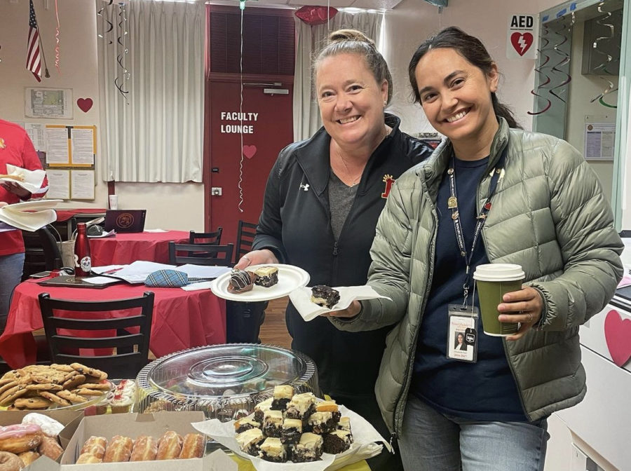 Mrs. Flati and Mrs. Hunt enjoying the breakfast provided by the sophmore class. (Photo taken from @rosaryparentcouncil)