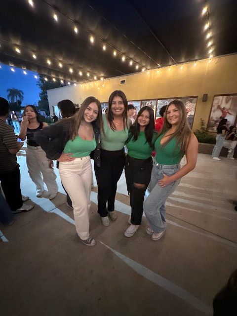 Seniors Bella Florin, Valeria Avila, McKinley Fregoso, and Jacee Baumann pose in matching alien-green tops!