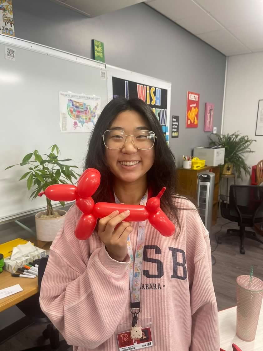 Mallory with her specialty creation, a balloon dog!