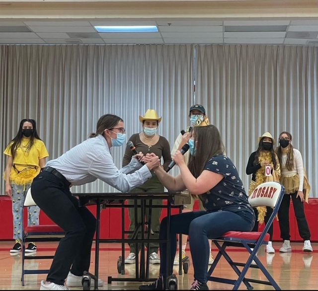 Portrayals of Mr. Clough and Mrs. Barclay battle it out in the 2022 Gold kickoff skit.  
