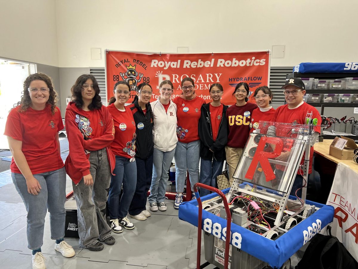 Royal+Rebel+Robotics+poses+with+their+robot+Make+Sum+Noize+at+the+Los+Angeles+Regional+FRC+2024.
