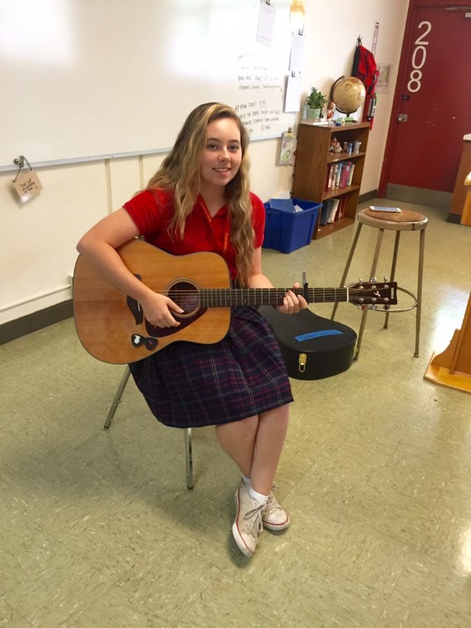 Kat Davis poses with her guitar.