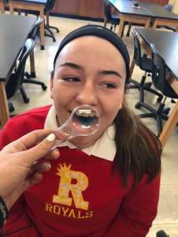 Sophomore Caroline Linton participates in an AP BIo lab designed to test our taste.  Photo by Sophia Lambrose