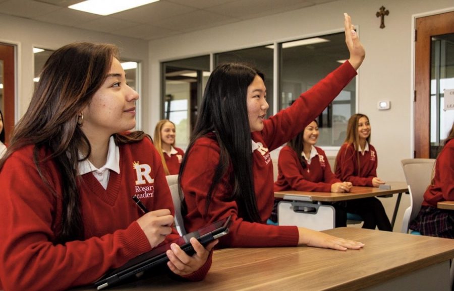 Alicia Ventura' 21 and Natalie Kim' 22 having fun while participating in class.