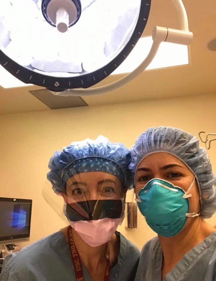 My mom, Dr. Moyers (left), and her best friend, Dr. Tajali, take a selfie in the operating room.