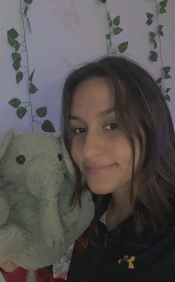 Kate Rosales ‘23 is all smiles alongside her long-time stuffed animal buddy Fanney.  