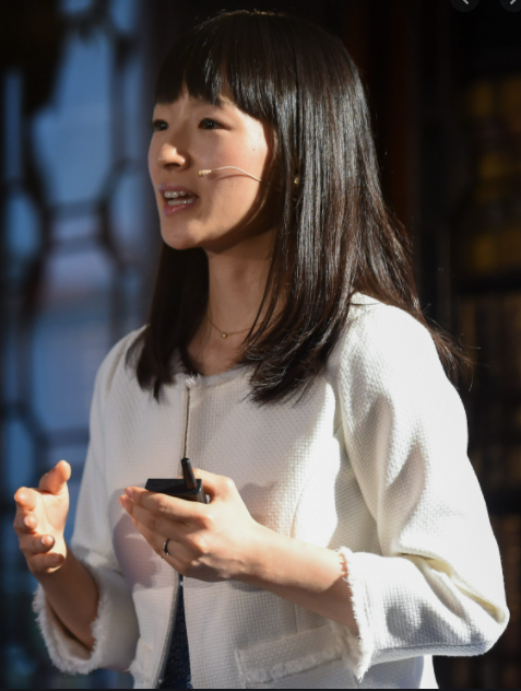 Marie Kondo speaking at  a summit regarding her organization methods. 