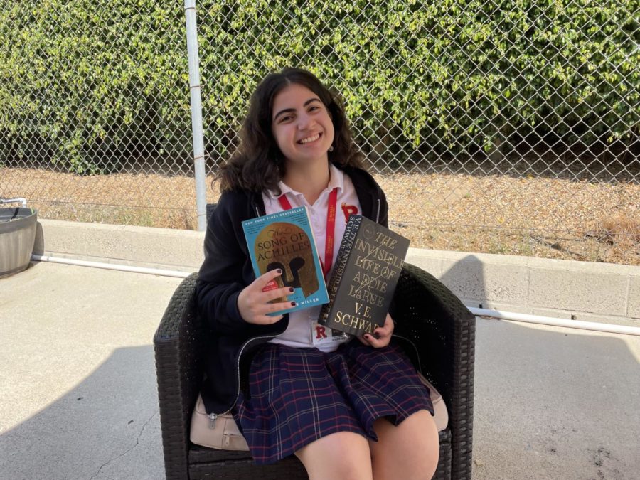 Mary Nassar '22 posing with "The Song of Achilles" and "The Invisible Life of Addie LaRue."
(Photo by: Irene Fernandez)
