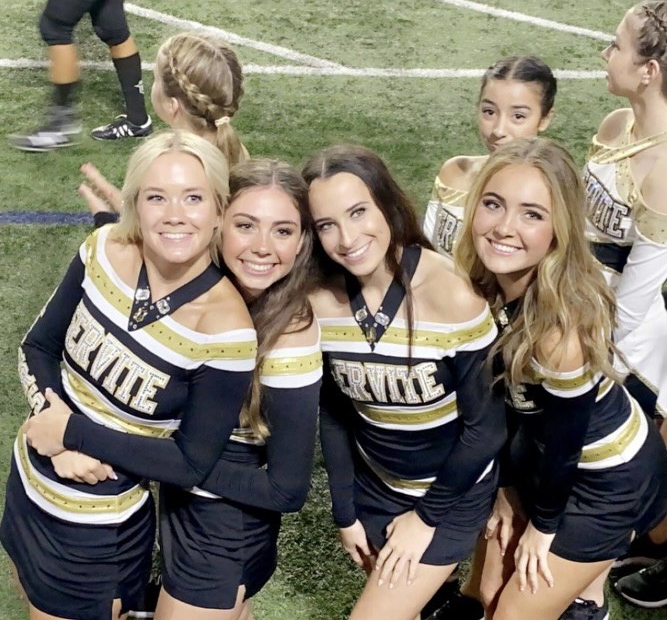 Daly Holman '22 with her fellow seniors before they preform for halftime.
