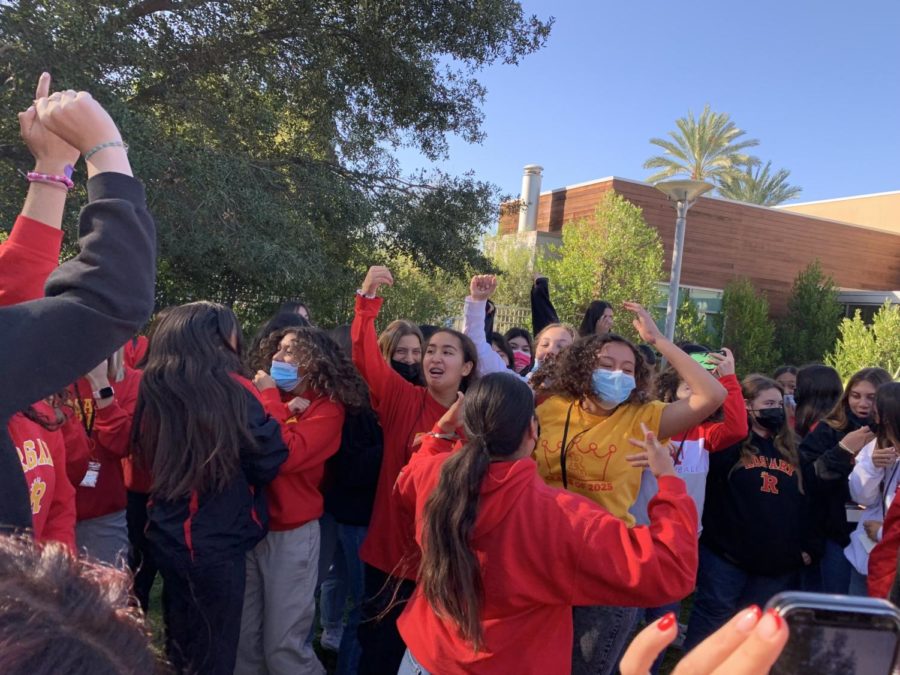 The freshman class cheering for one of the icebreakers game they won.
