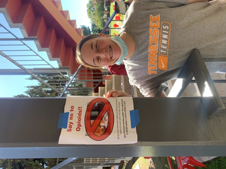 
Sophomore Sonoma Baumgartner smiling with a "say no to opioids" sign.
