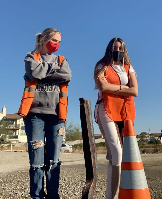 Kathleen Martinez stands with former Rosary student at work at the Christmas Tree farm. (Photo Credit: Kathleen Martinez)