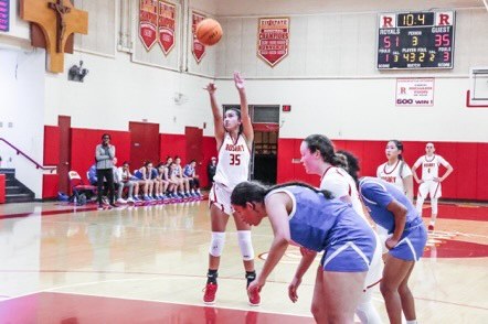 
Ava Dominguez'22 taking a shot during the game. 
