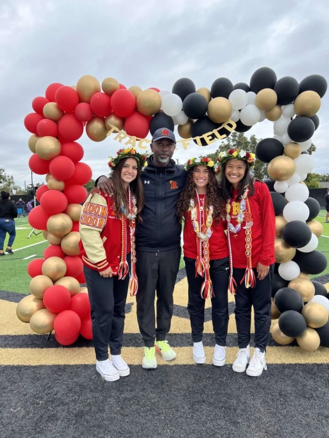 Senior captains, Gabriella Cardenas, Elena Navarro, and Lauren Aquino with their head coach, Brandon Thomas, moments before competing in the meet. 