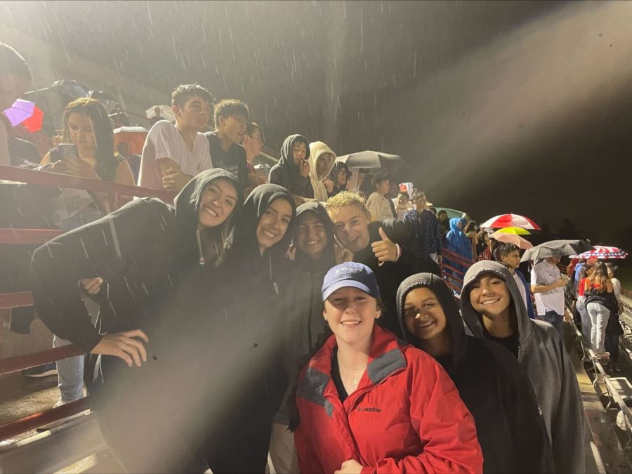 Seniors Francesca McGuire, Amber Lizardi, Emma Oskorus , Colleen Schmitt, Ava Bernard '24, and McKinley Fregoso '24 all soaked and bundled up, cheering on their brothers in the stands. (Photo Credit: Reagan Beuerlein)