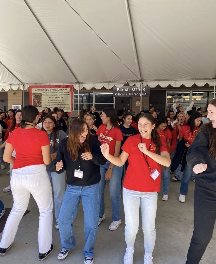 Rosary's juniors dancing to the cha-cha slide at their retreat.