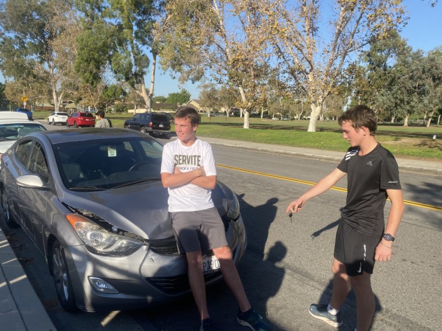 Josh Siebert '24 and Jake Ratzlaff '24 trying to hide the fact that Josh crashed his car on the way to practice.