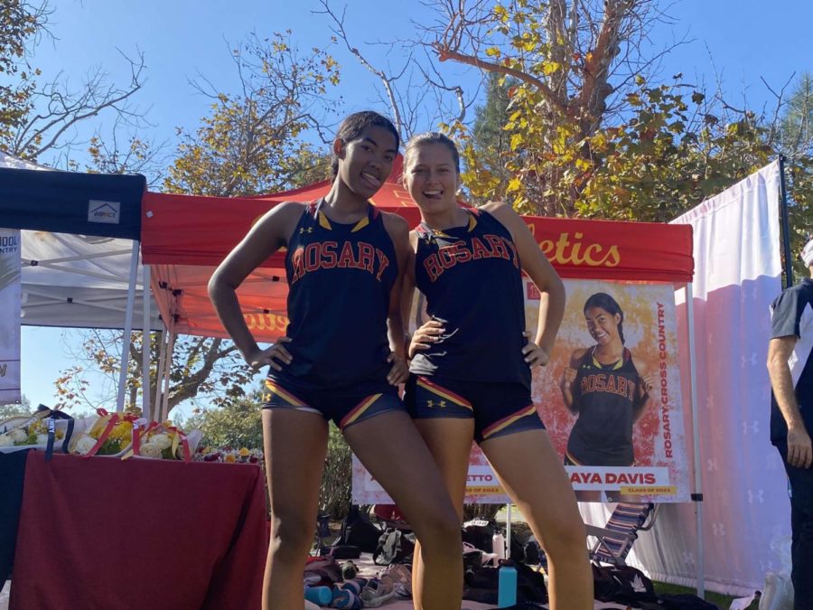 Maya Davis and Annabella Barretto posing pre-race in front of the Rosary tent. 