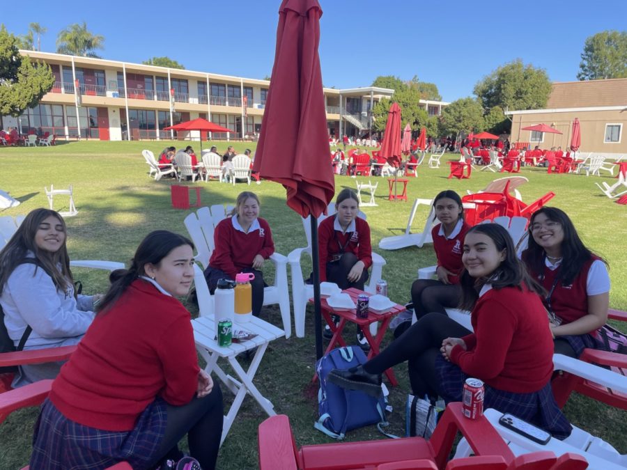 Senior and sophomore sisters spending quality time together during lunch. 