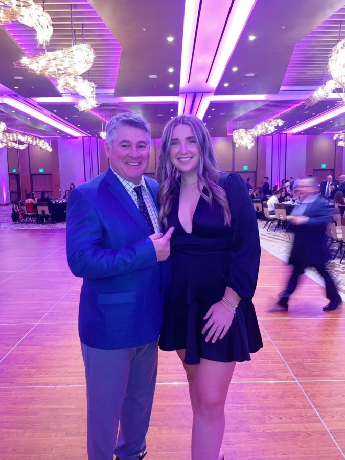 Reagan Beuerlein snaps a picture with her dad for her very last father daughter dance. 
