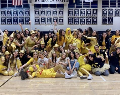The class of 2022s Gold team posing for their last Red and Gold.