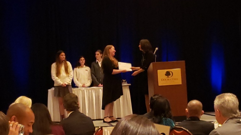 Mrs. Hunt receives her Teacher of the Year Finalist Award from Dr. Barisano at the Diocesan Awards Ceremony.