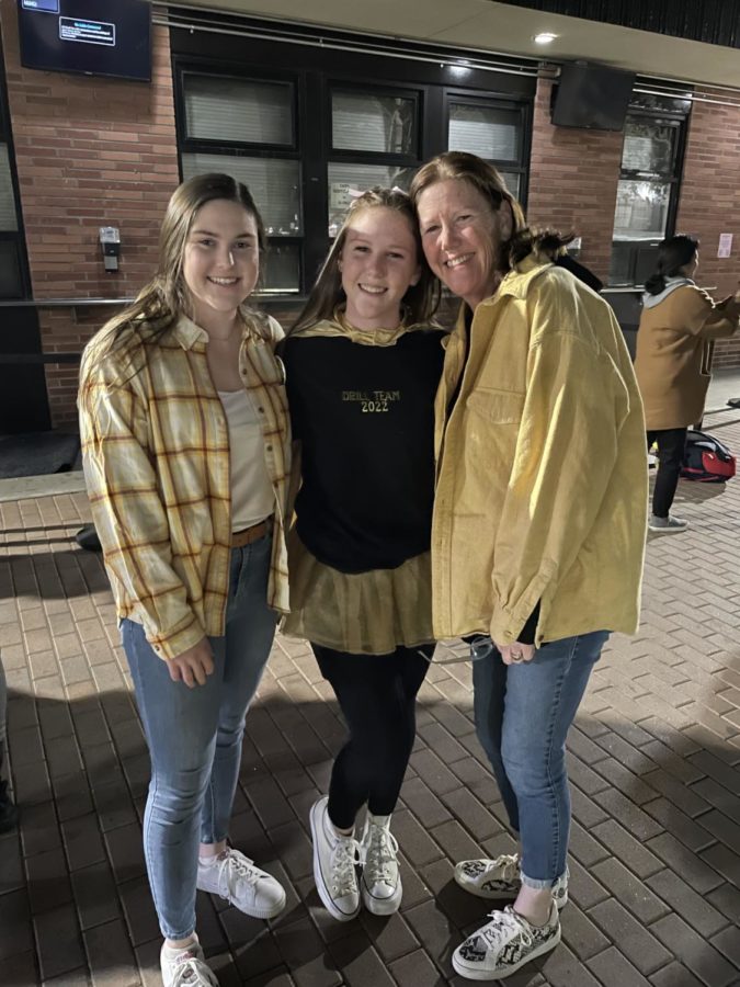 Colleen Schmitt '23 and her mom smile big post Red and Gold performance.
