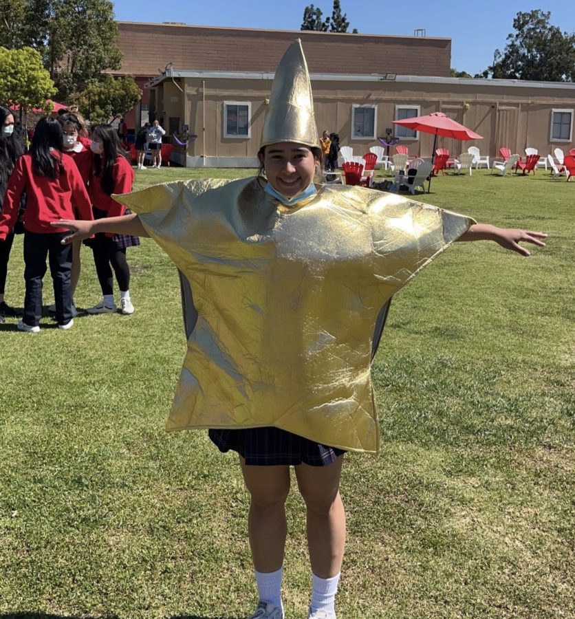 Kimi Watanabe '23 shows off the star costume that she fist fought someone over. (Photo credit: Trista Verne '23)