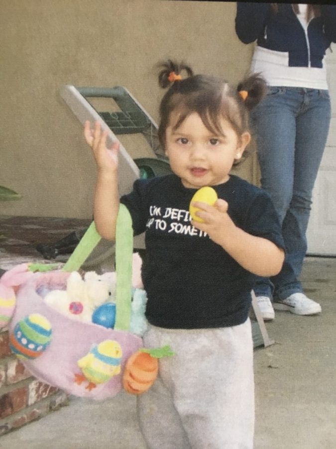 As the shirt says, baby me is "definitely up to something" while hunting for Easter eggs.