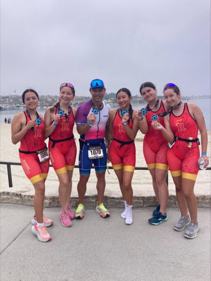 The triathlon team showing off their medals fresh off the finish line. (Photo provided by Tracye Vaughan)