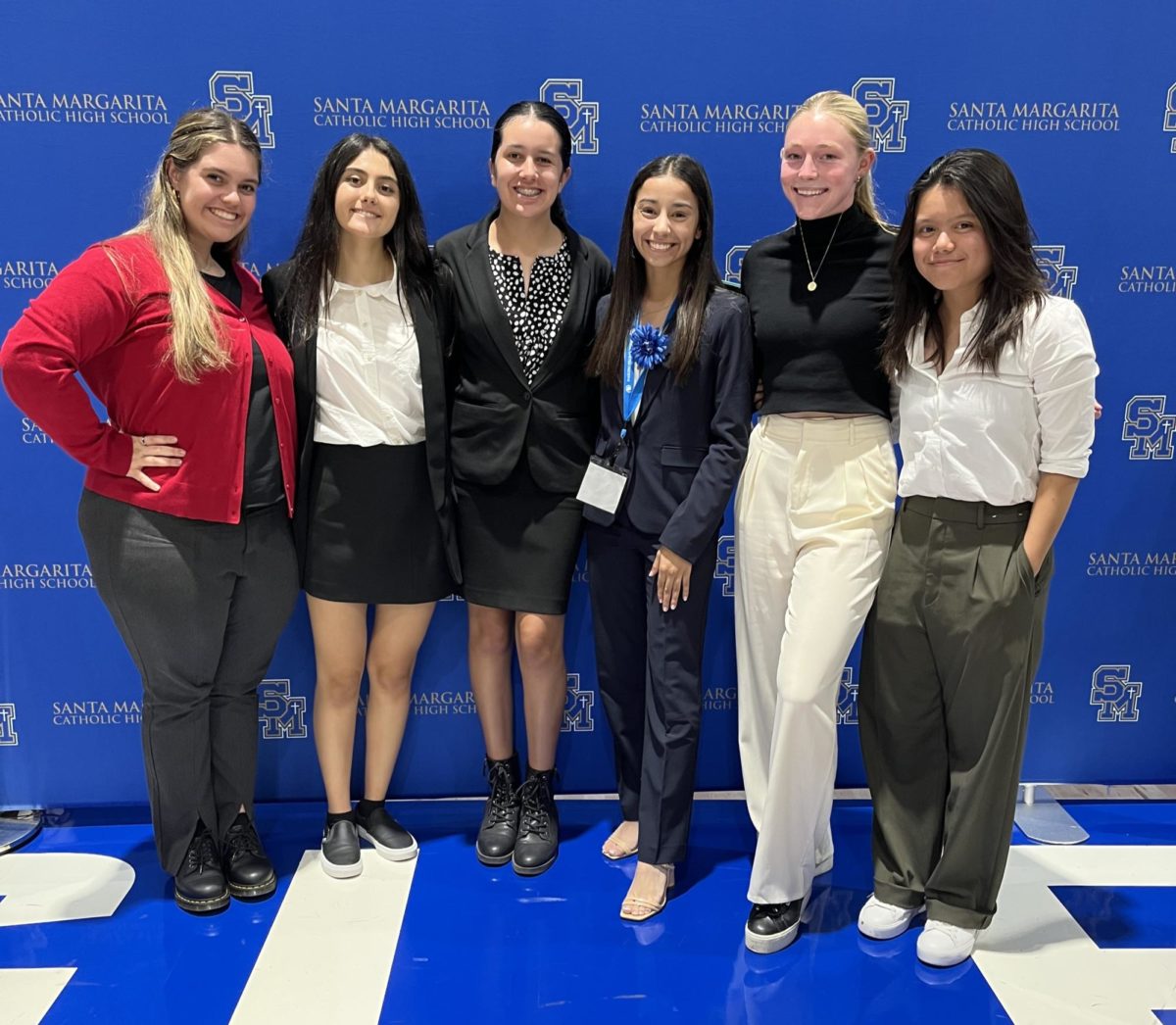 Royal MUNers smile in Santa Margarita's gym, where the opening and closing ceremonies took place. 