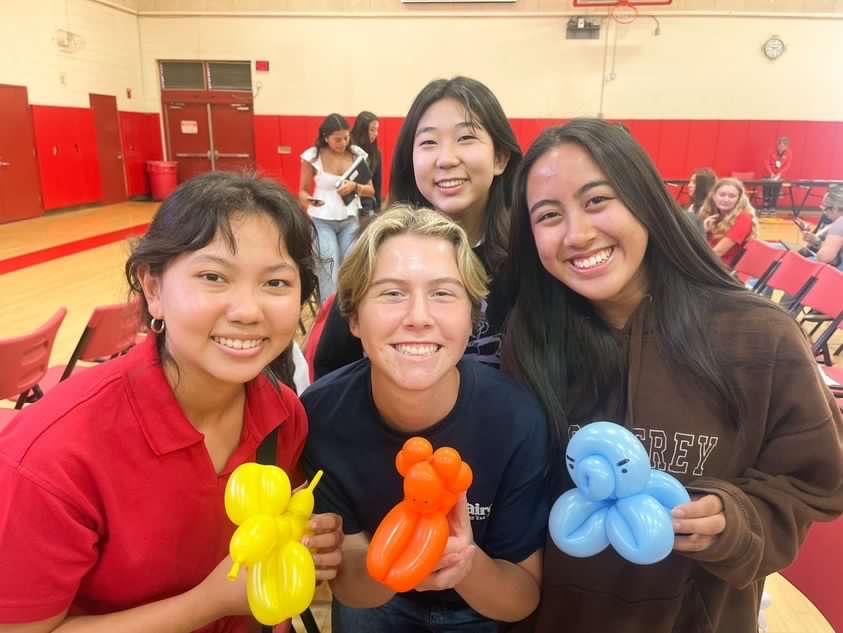 Seniors Sara Garcia, Kit Hayward, and Nia Delacruz posing with their new balloon friends. How cute is that?