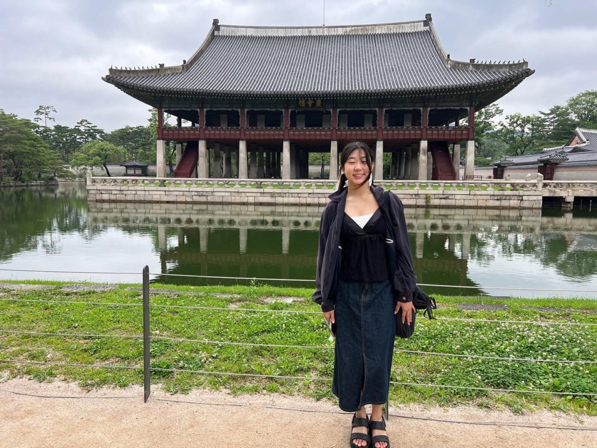 Mallory Mojica-Ye in front of the party hall of past Korean kings.