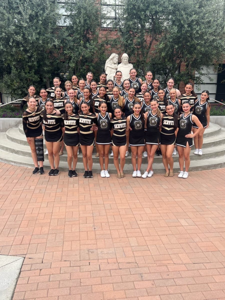 Cheer and Dance teams pose for a group picture to capture this memory.