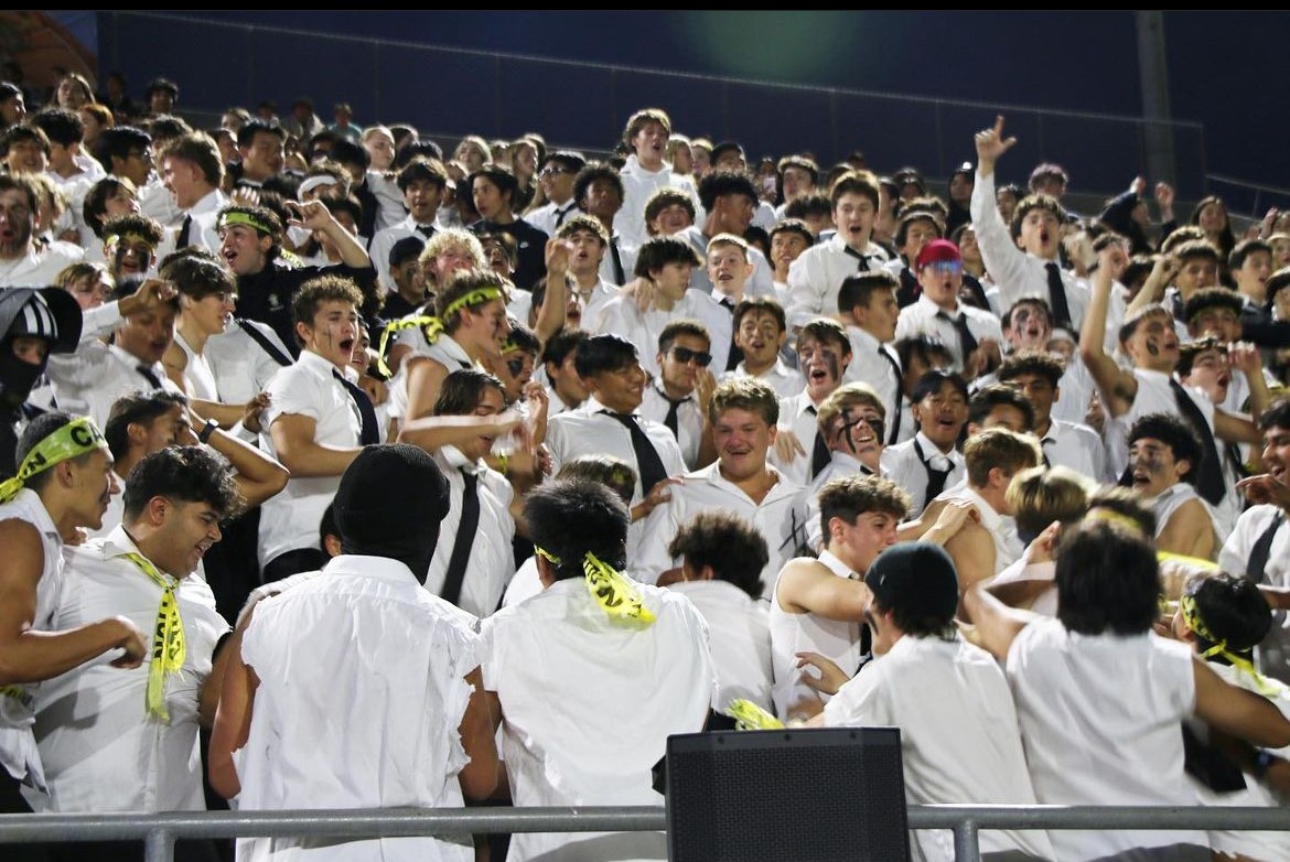 The Servite student section celebrating at the football game.