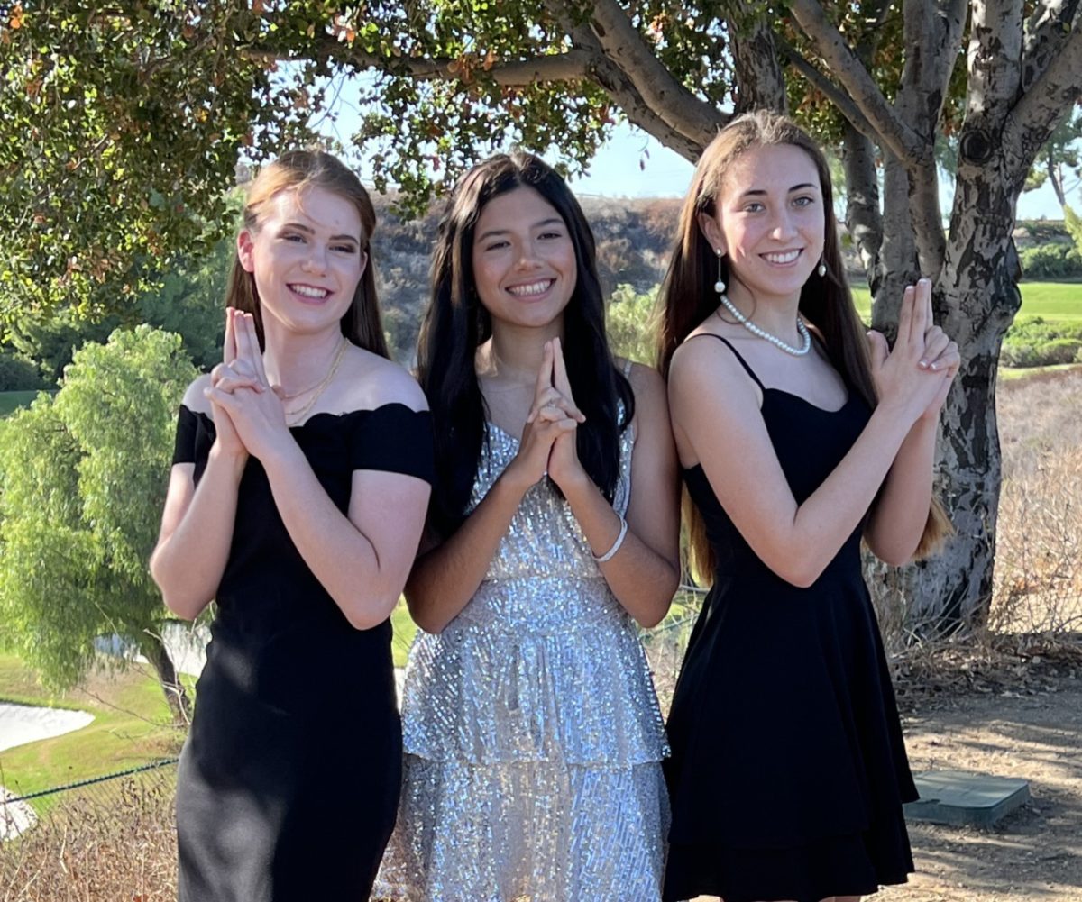 Senior princess Madison Roach poses with Grace Kaiser '24 and Madison Verdugo '24.