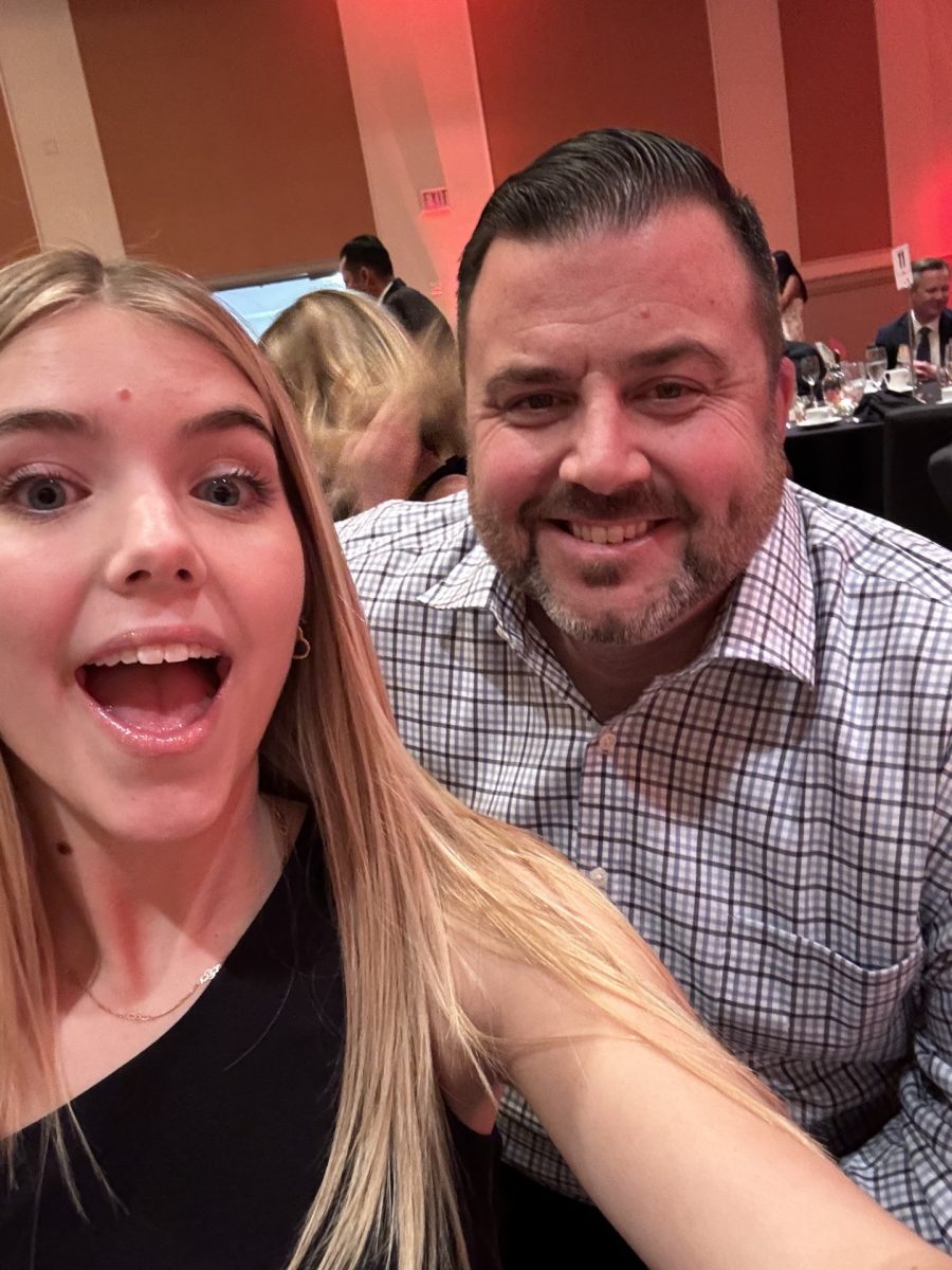 Lexie Curtis and her dad are all smiles as they prepare to hit the dance floor. 